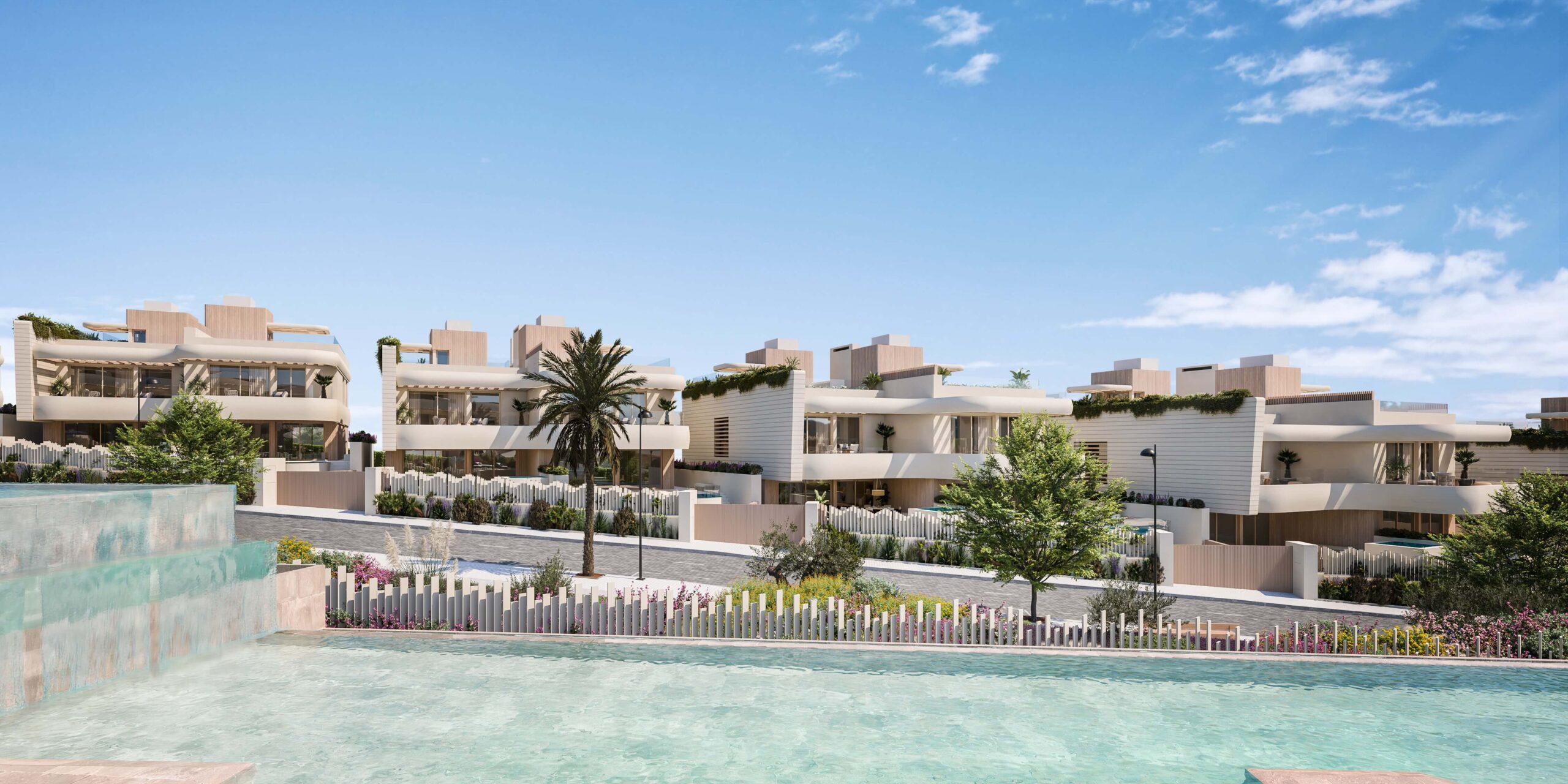 Townhouses omgeven door tuinen en zwembaden