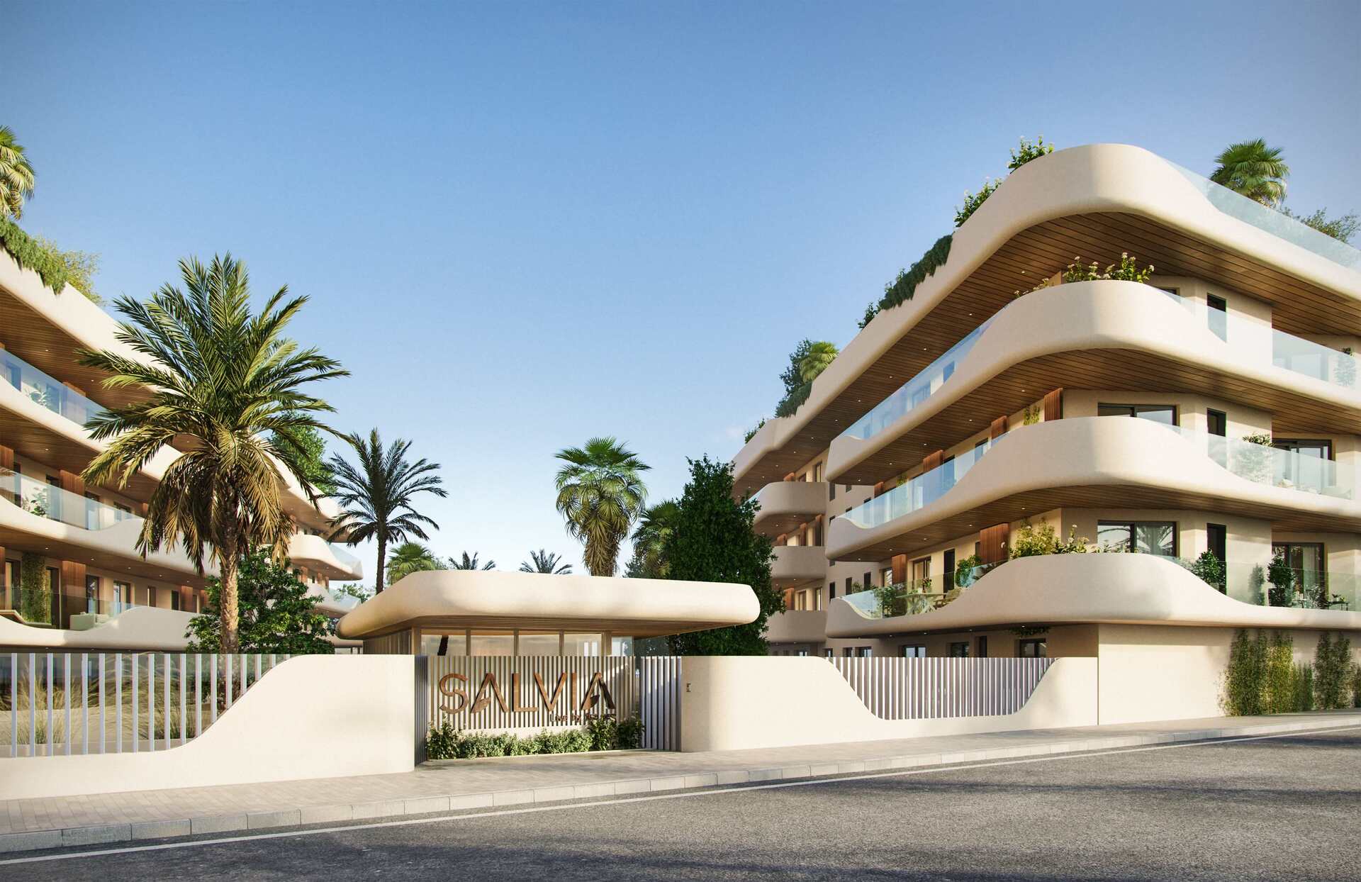 Ingang van het complex met palmbomen
