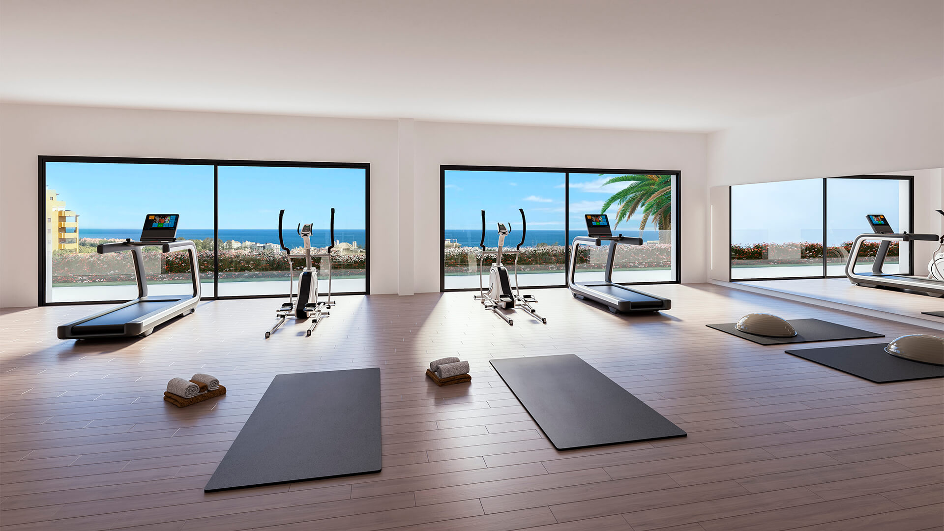 Fitnessruimte met zicht op zee