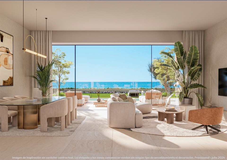 Woon- en eetkamer met open zicht op zee