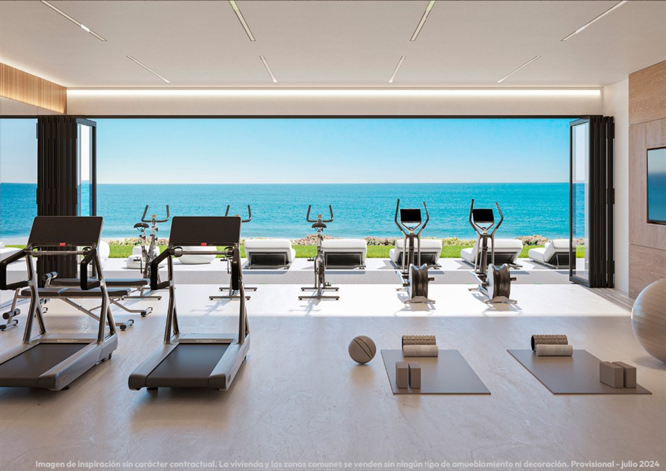 Fitnessruimte met rechtstreeks zicht op zee