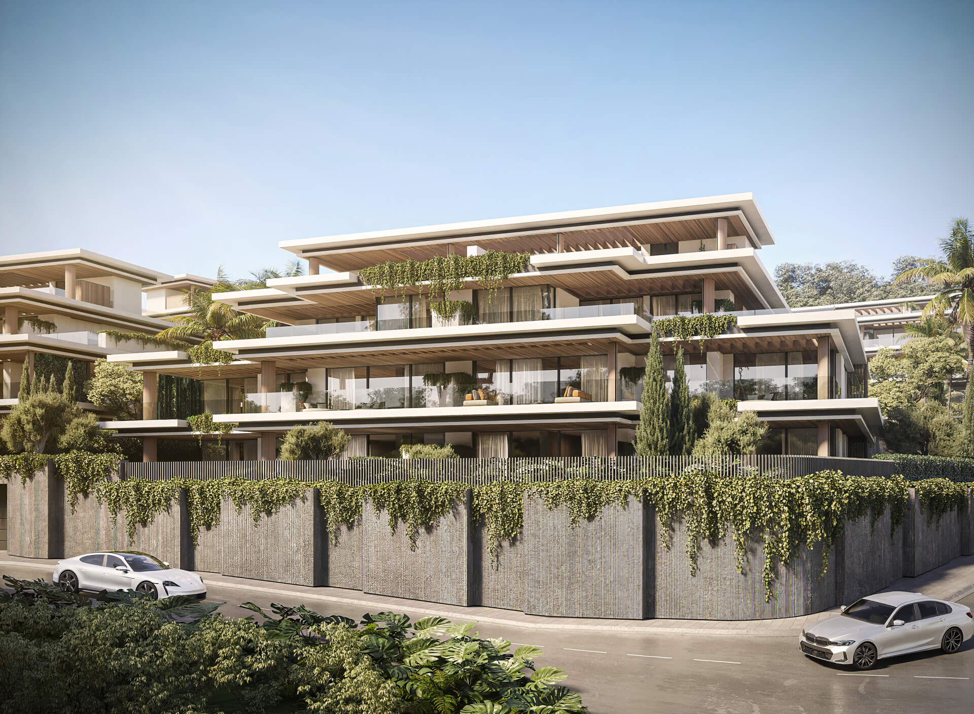 Gevel van Essence Residence omgeven door groen