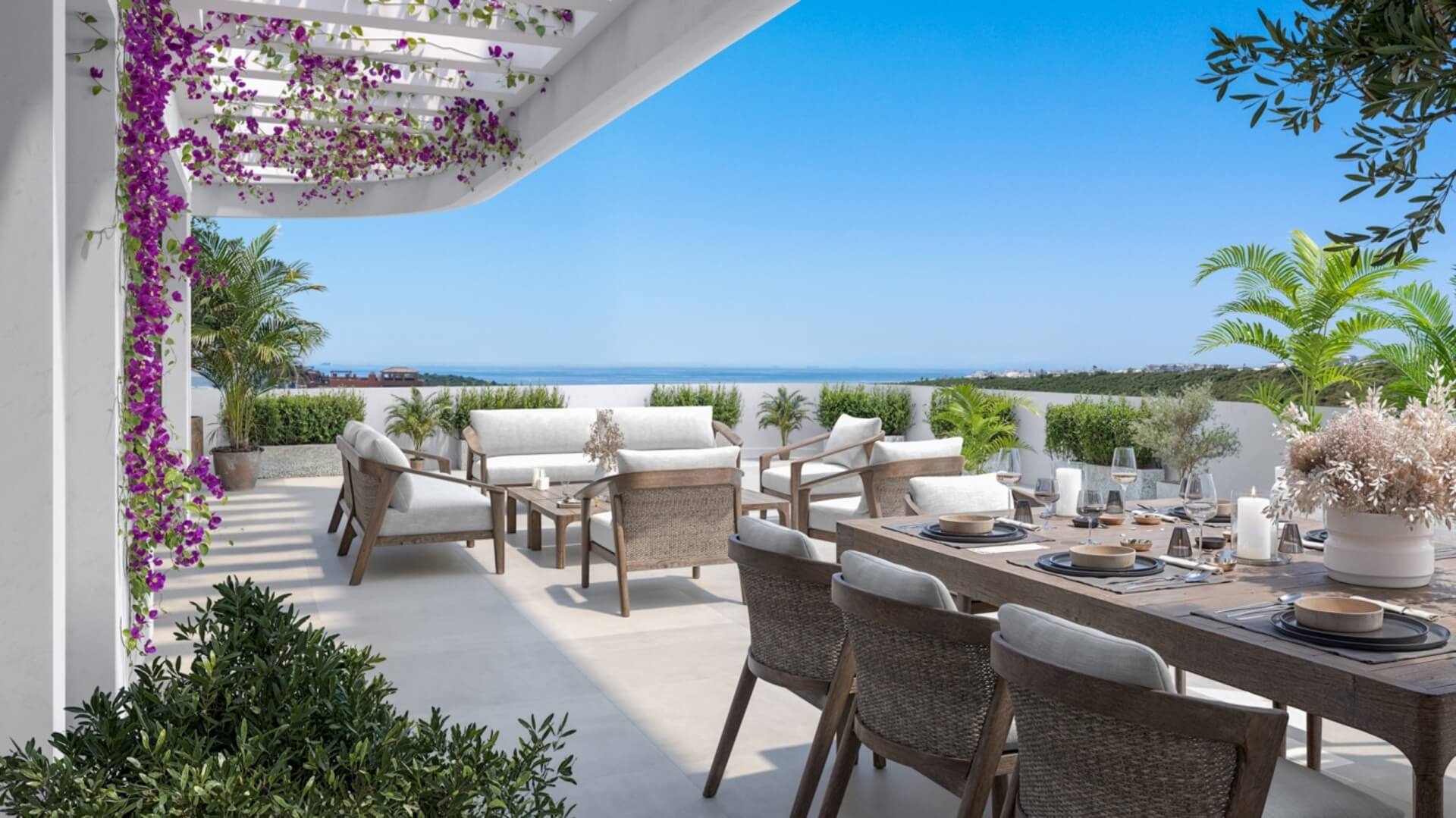 Terras met eettafel en zicht op zee