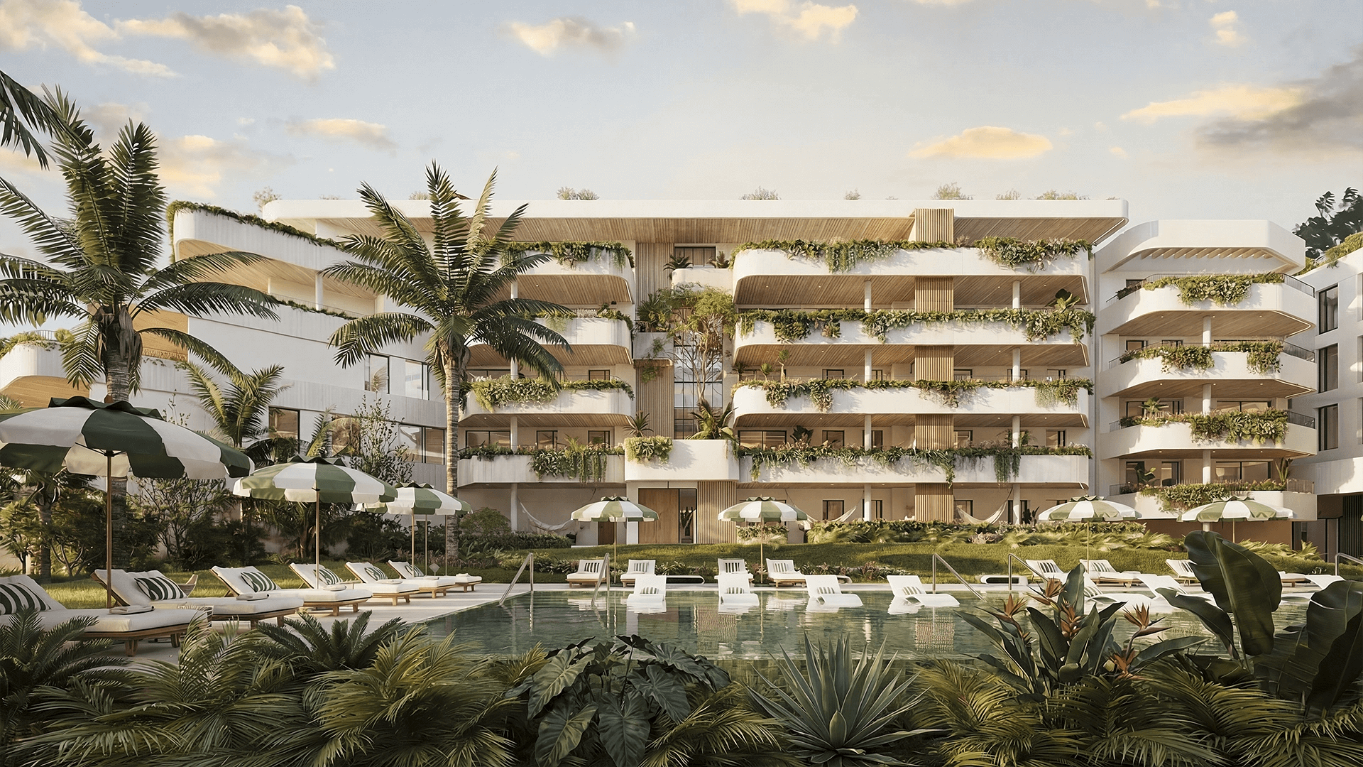 Appartementencomplex met zwembad omgeven door weelderig groen