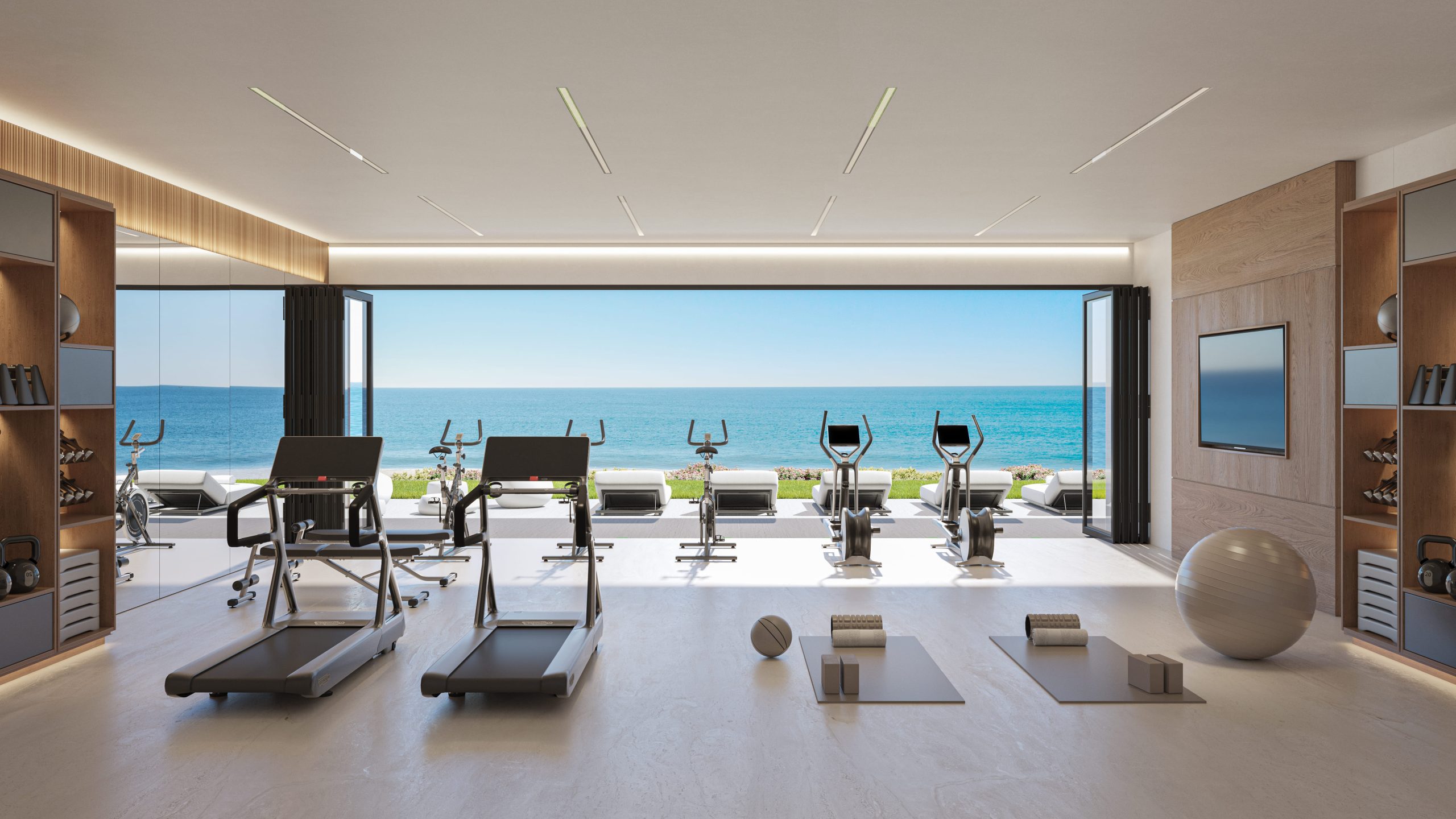 Fitnessruimte met rechtstreeks zicht op zee