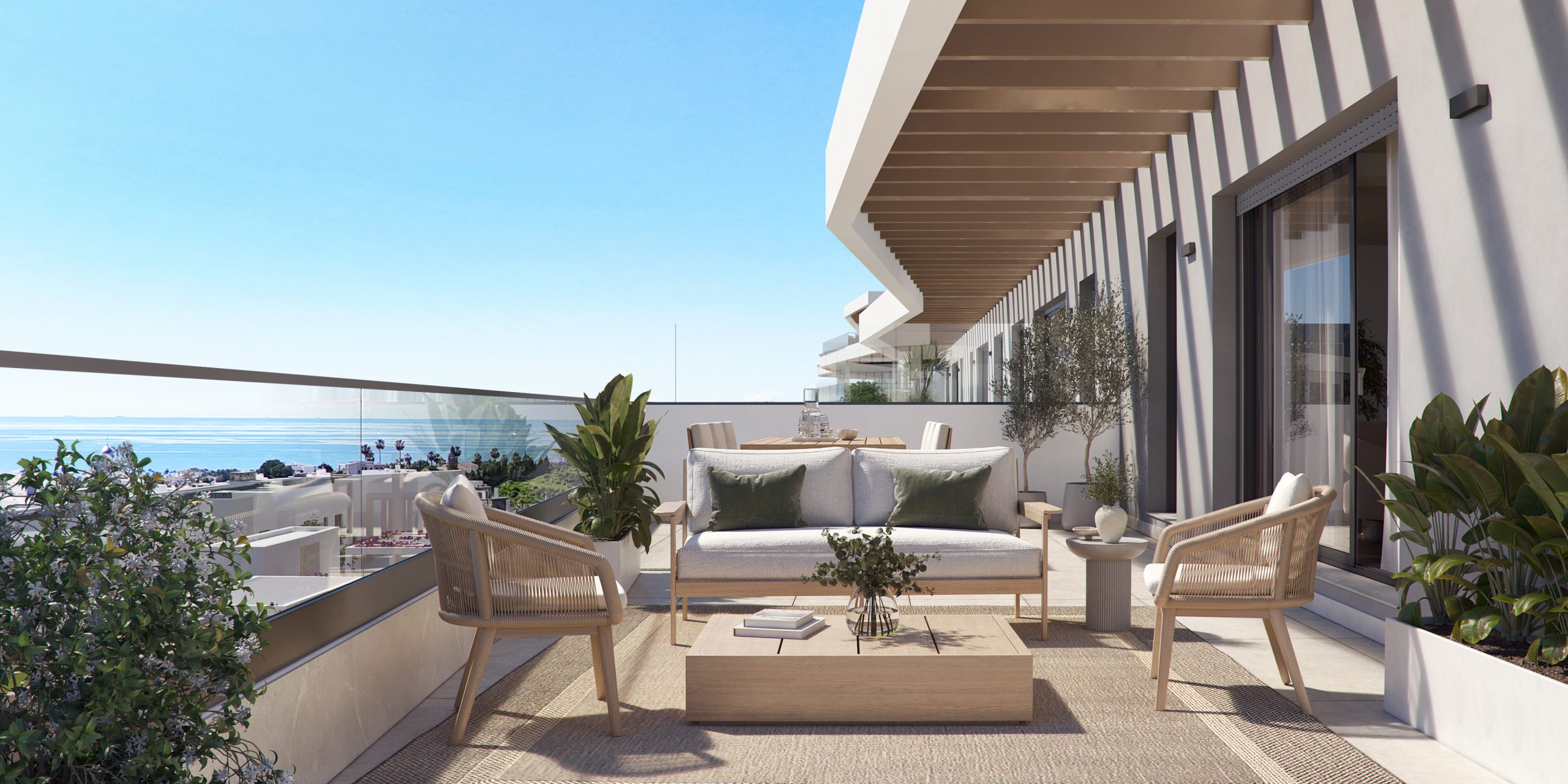 Terras met loungezetels en zicht op zee